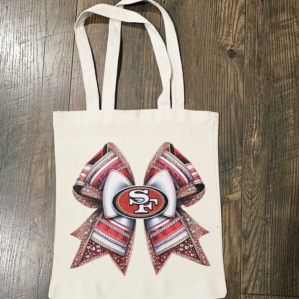 Elegant Cream Tote with Red and Silver Bow